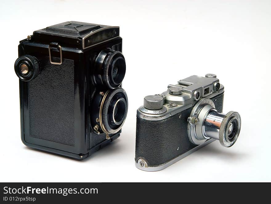 Two old photo cameras on white background. Two old photo cameras on white background