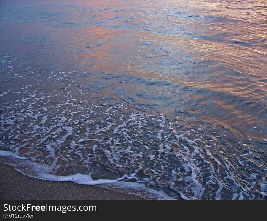 Sunrise colors reflected in the Florida surf. Sunrise colors reflected in the Florida surf