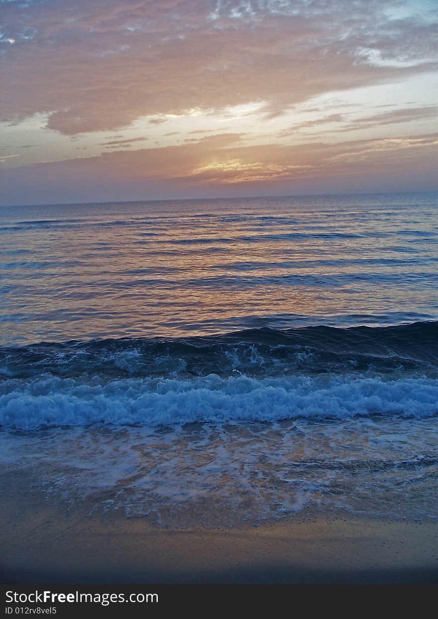 Sunrise colors reflected in the Florida surf. Sunrise colors reflected in the Florida surf