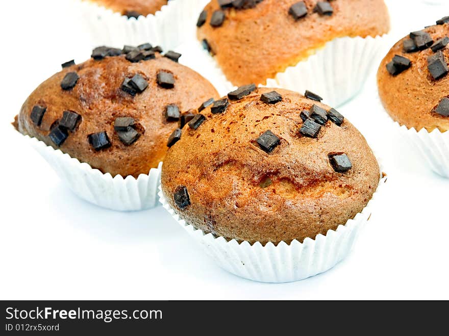 Chocolate muffins with decoration - isolated on wh