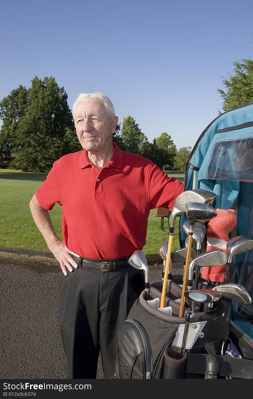 Man Next to Golf Cart Smiling