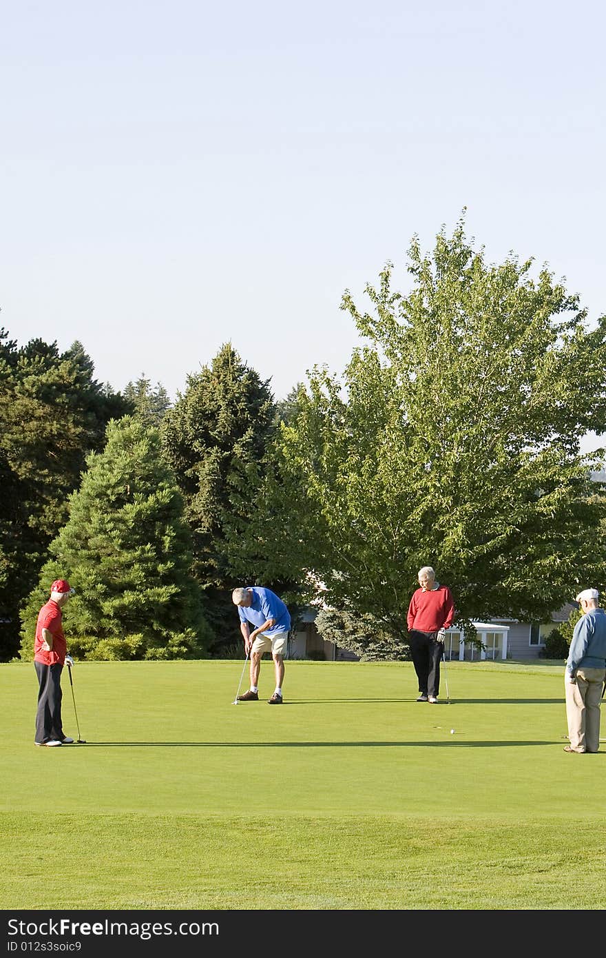 Men Playing Golf on Course