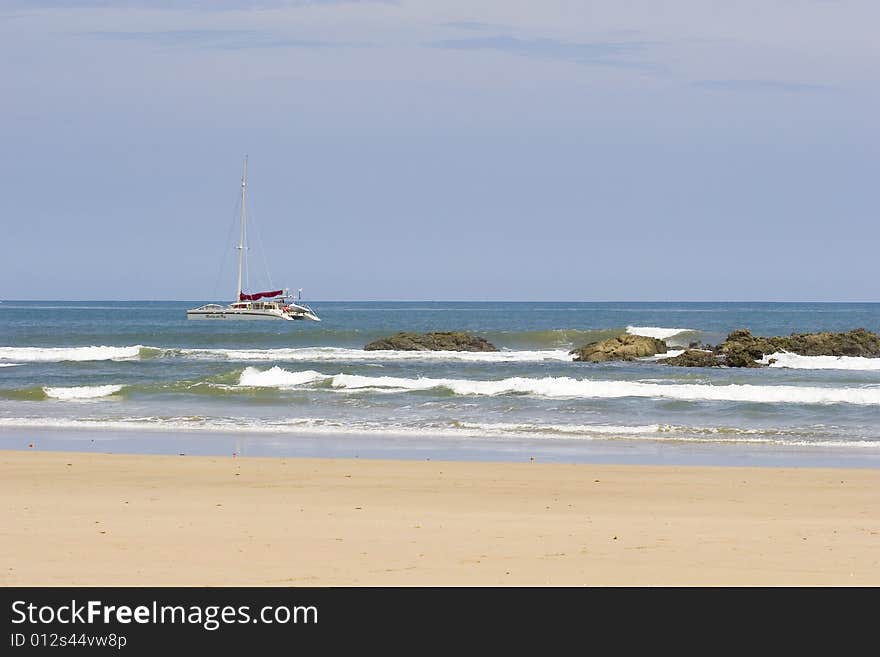 Sailboat Past Rocks