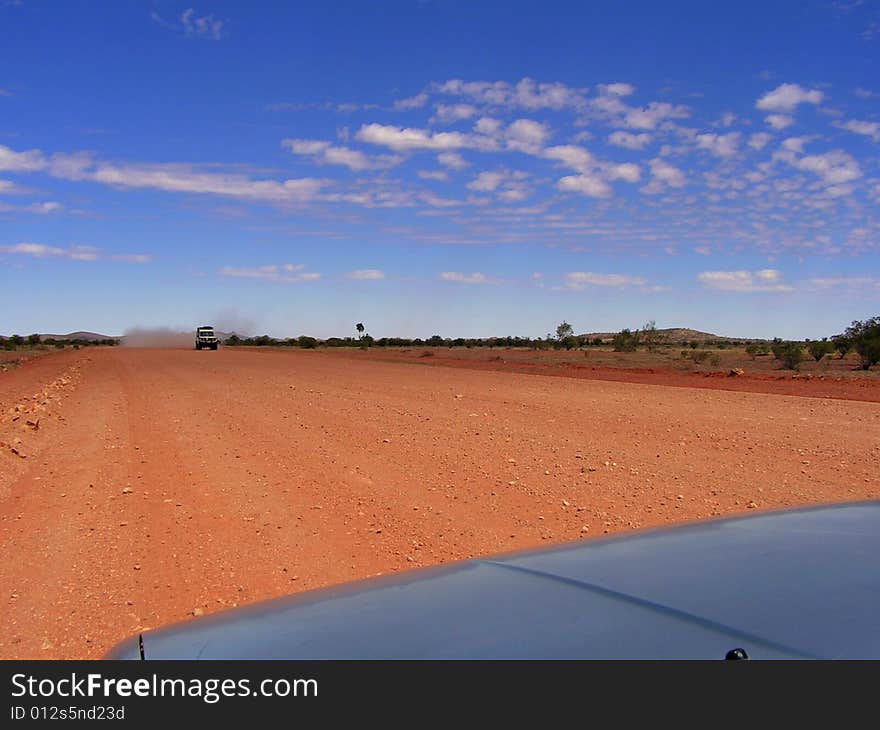 Driving along the Ernest Giles Road from Alice Springs to Kings Canyon