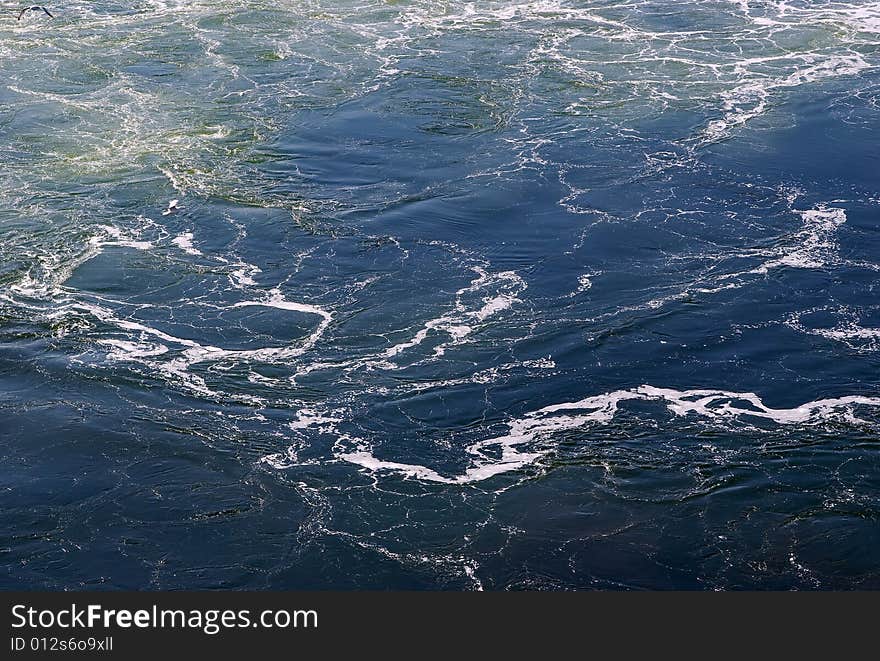 Foam on water created by power plant