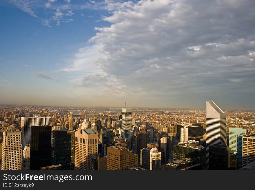 View of uptown Manhattan and Central Park, from atop a skyscraper, New York City. View of uptown Manhattan and Central Park, from atop a skyscraper, New York City.