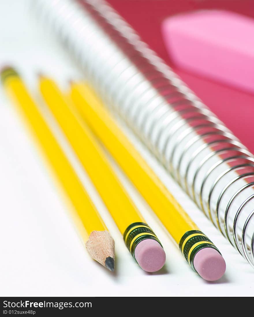 Three Pencils With Notebook