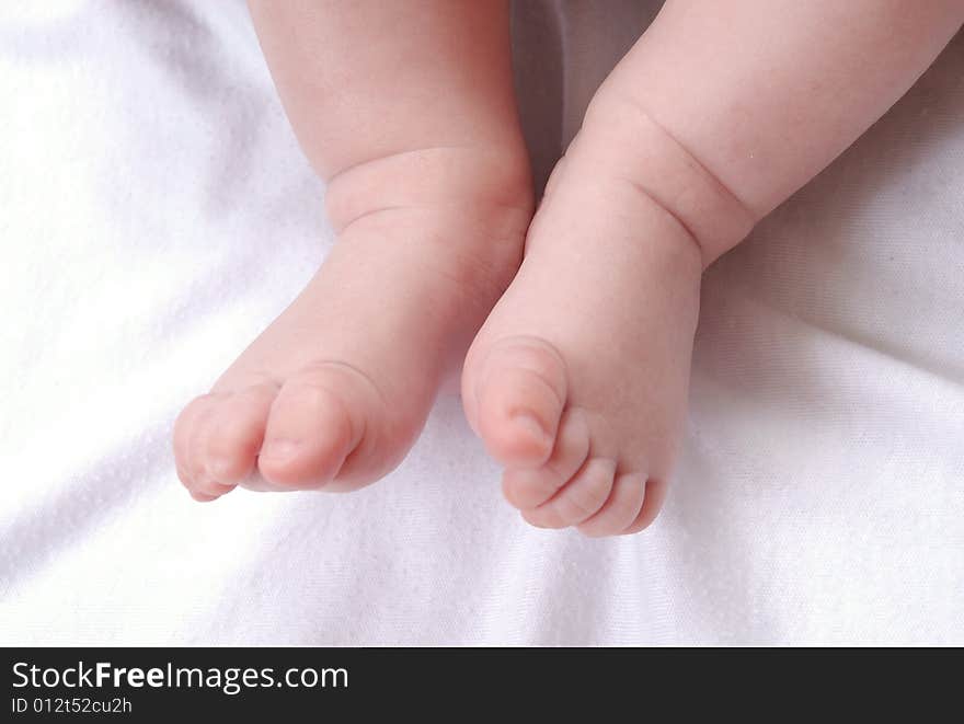 Father's and baby's hands isolated on white