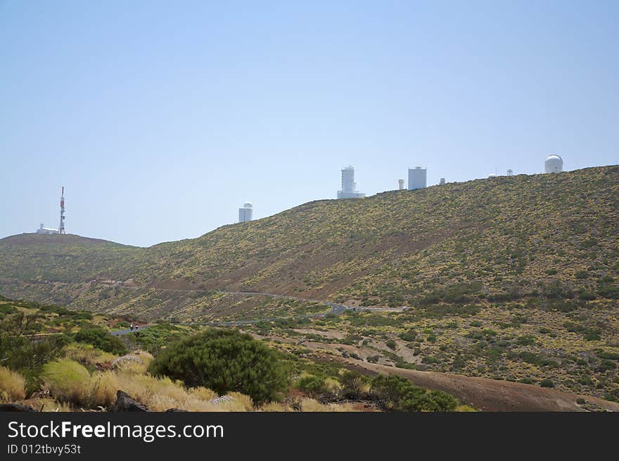 Astrophysic white buildings on a green mountain. Astrophysic white buildings on a green mountain