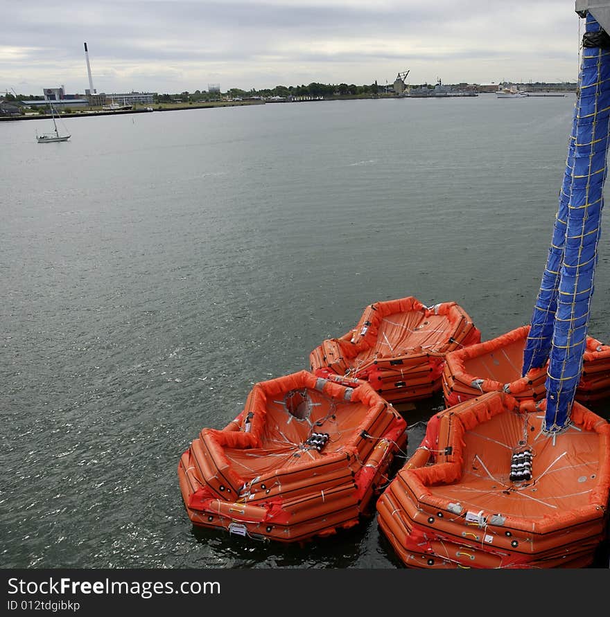 Inflatable marine evacuation system.
Evacuees slide down the blue chute and into the floating orange inflatables. Inflatable marine evacuation system.
Evacuees slide down the blue chute and into the floating orange inflatables.