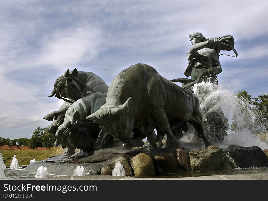 Statue of a woman riding a chariot pulled by bulls. This statue is outside the English Church in Langelinie, Denmark. Statue of a woman riding a chariot pulled by bulls. This statue is outside the English Church in Langelinie, Denmark.