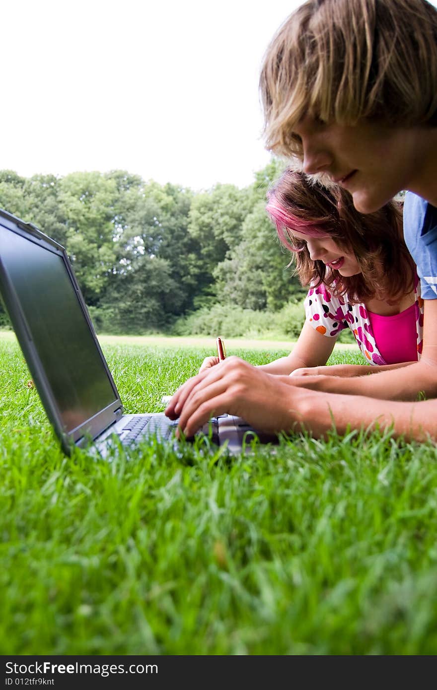 Students studying in a park in the summertime. Students studying in a park in the summertime