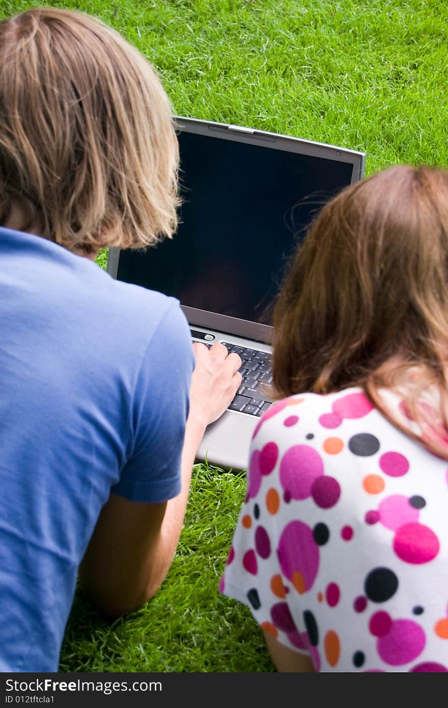 Students studying in a park in the summertime. Students studying in a park in the summertime