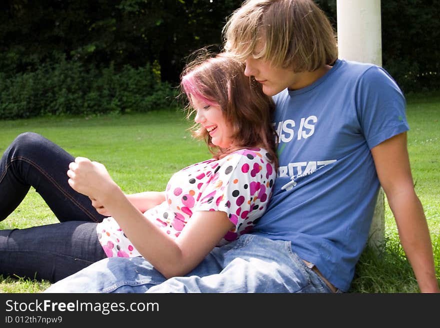 Students studying in a park in the summertime. Students studying in a park in the summertime