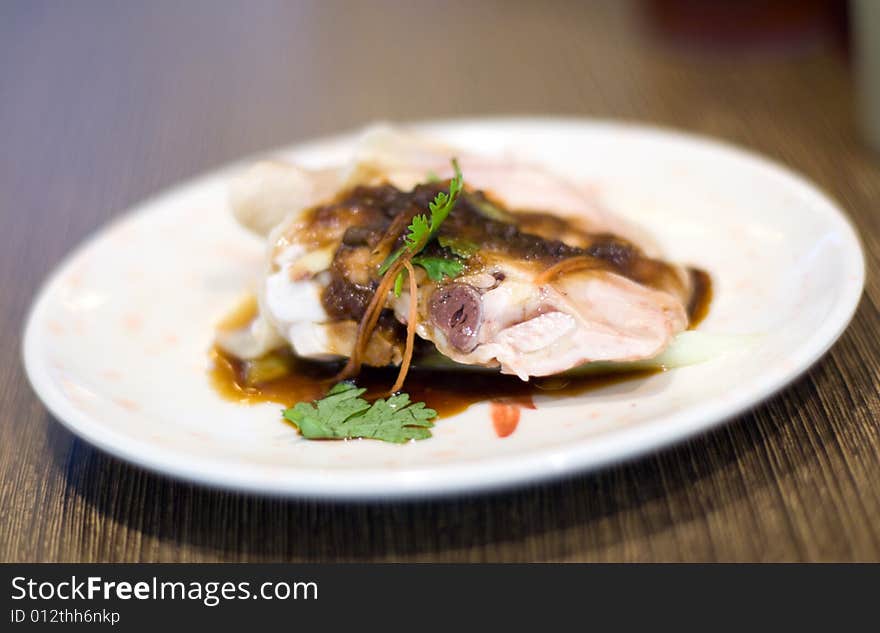 White Chicken - Japanese Buffet dish in white plate on dining table