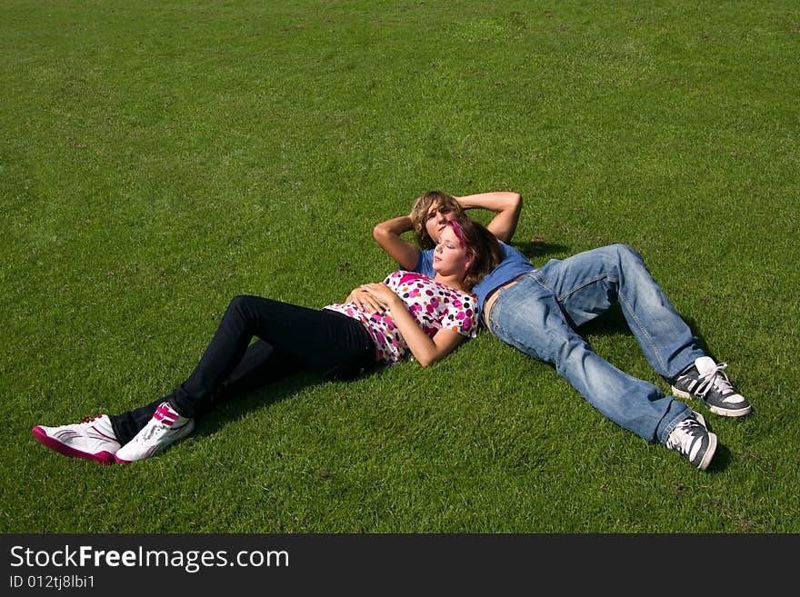 Students studying in a park in the summertime. Students studying in a park in the summertime