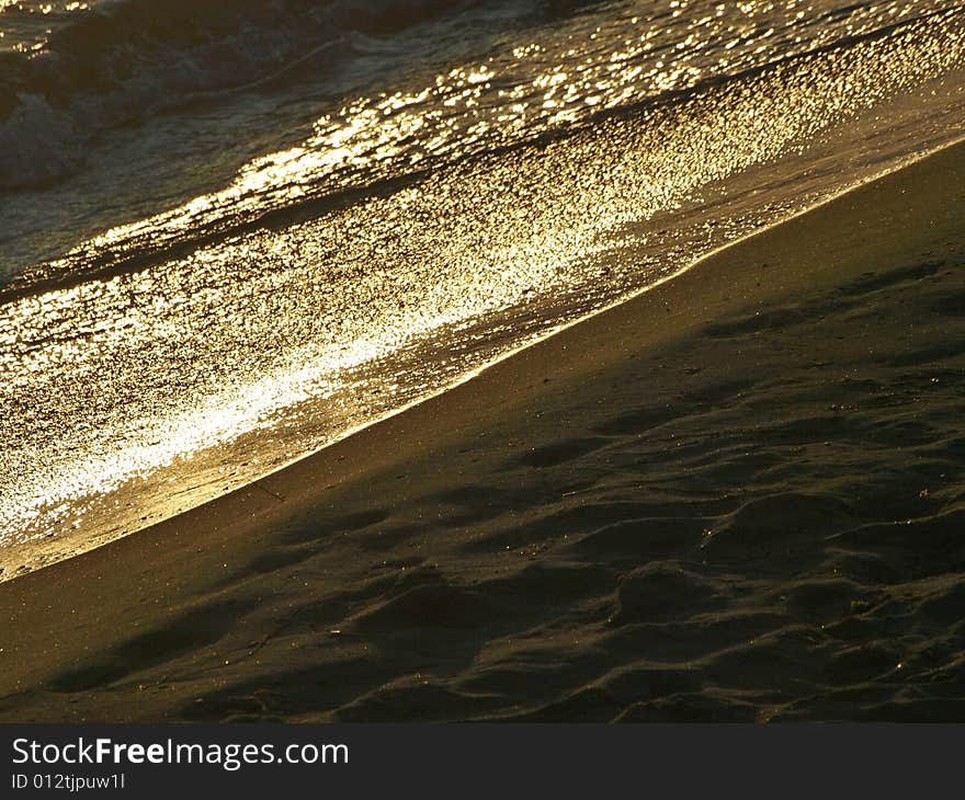 beautiful shot of water sea and sand on the beach. beautiful shot of water sea and sand on the beach