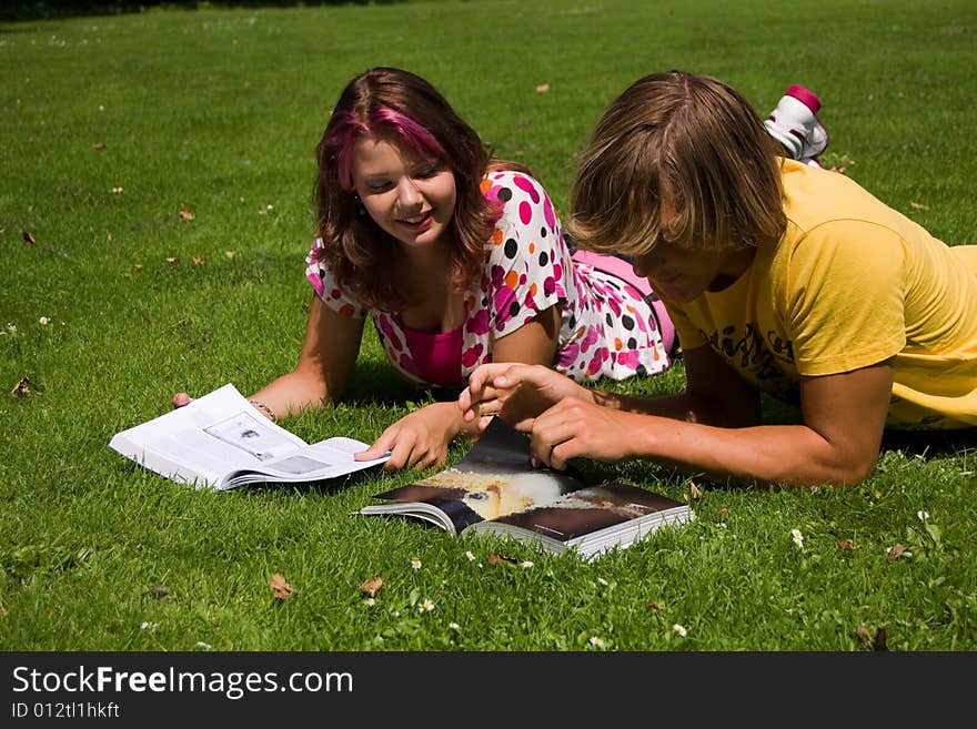 Students studying in a park in the summertime. Students studying in a park in the summertime