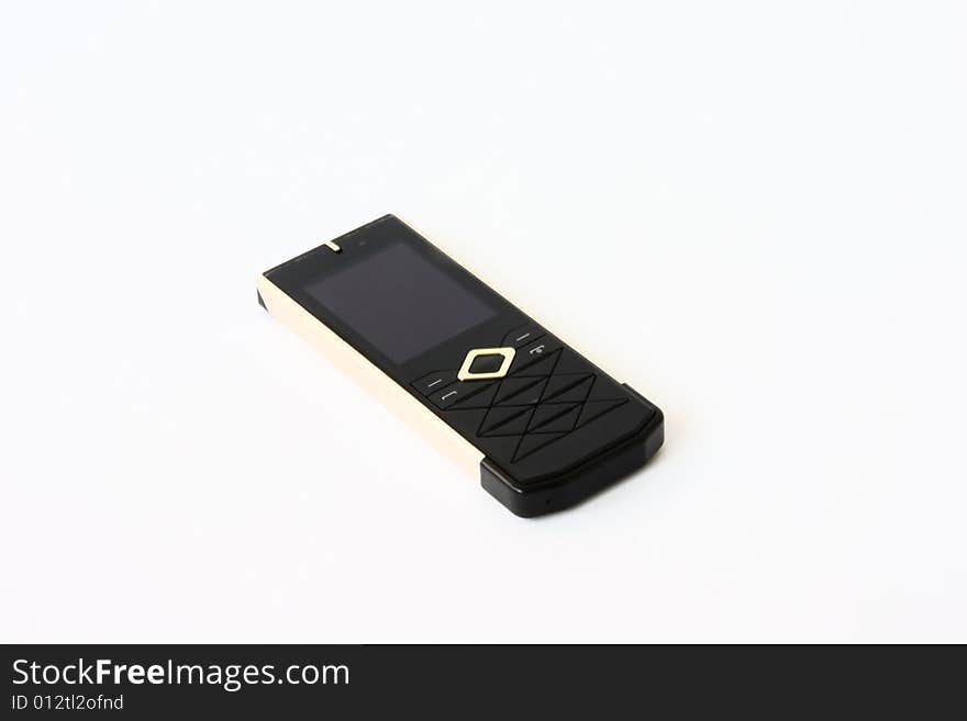 Gold mobile phone at the white background