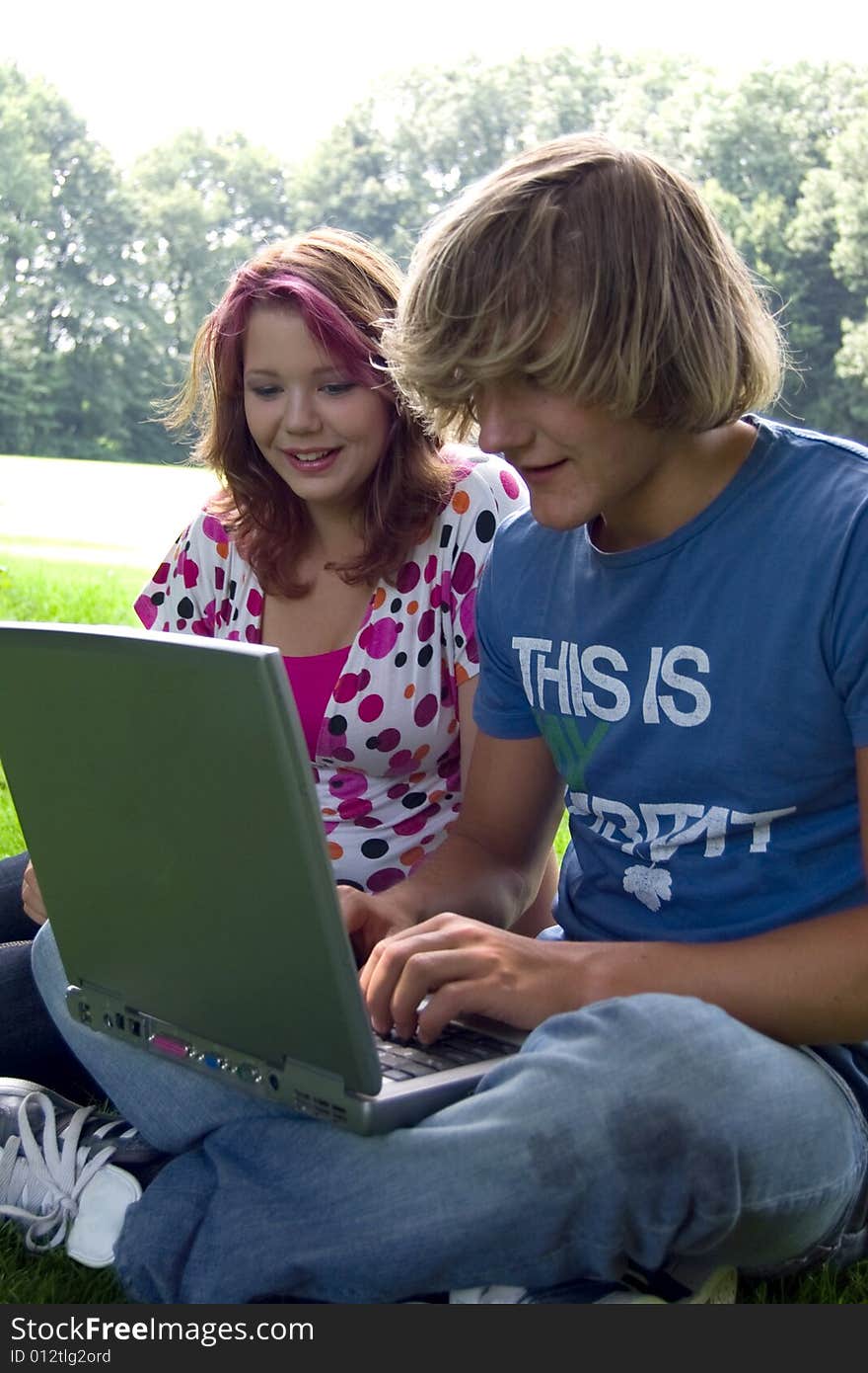 Students studying in a park in the summertime. Students studying in a park in the summertime