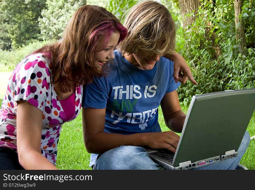 Students studying in a park in the summertime. Students studying in a park in the summertime