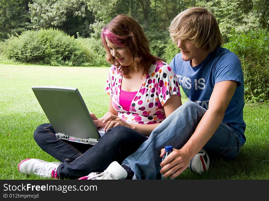 Students studying in a park in the summertime. Students studying in a park in the summertime