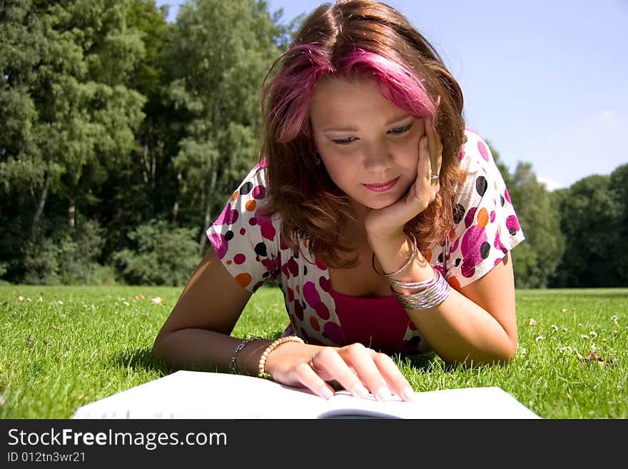 Students studying in a park in the summertime. Students studying in a park in the summertime