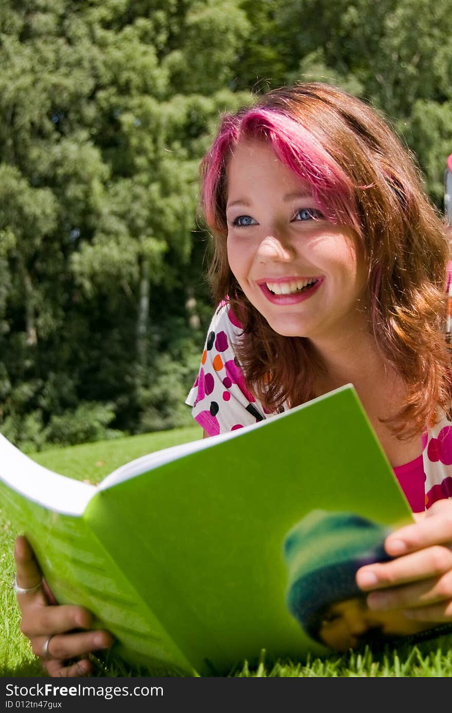 Students studying in a park in the summertime. Students studying in a park in the summertime