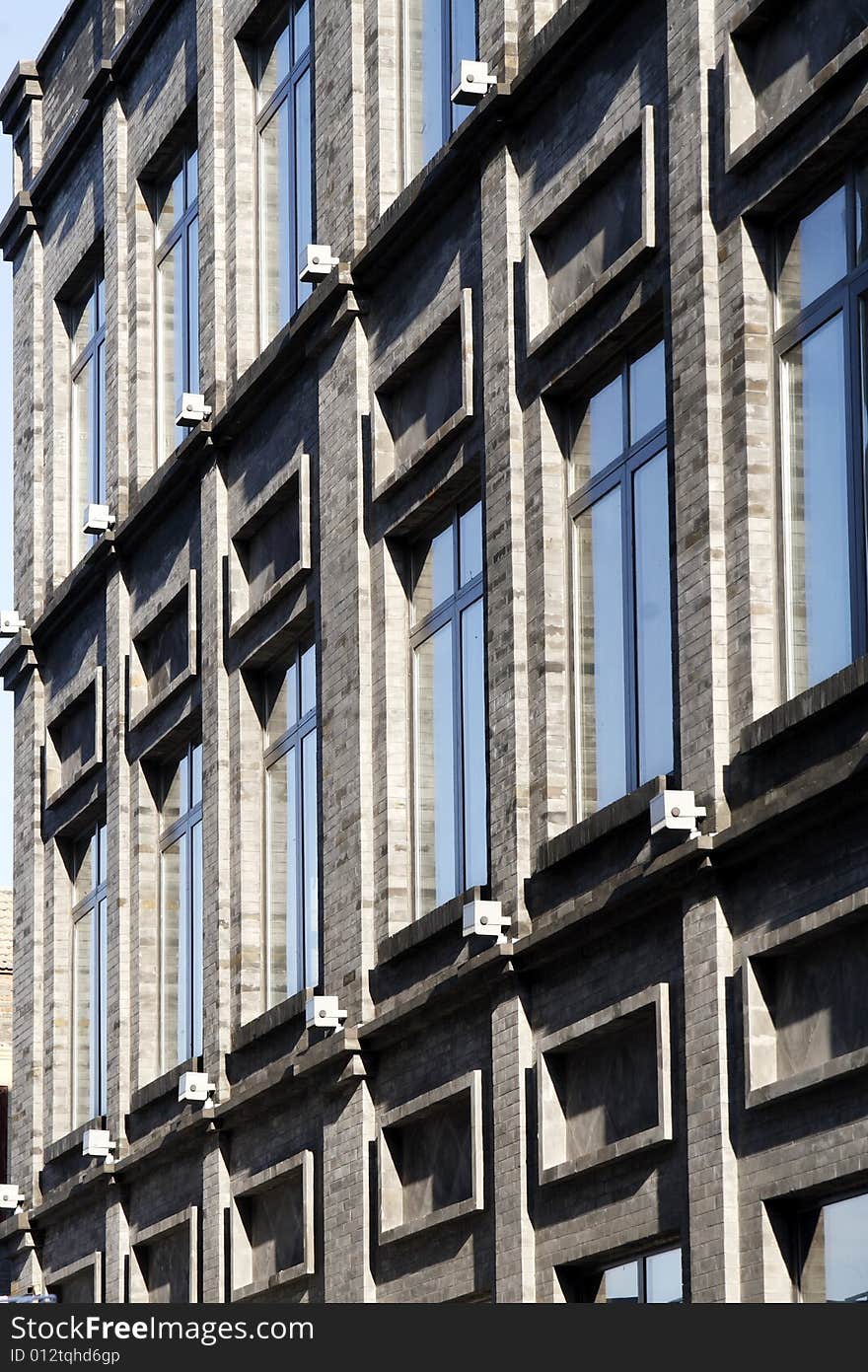 Building with many windows and reflection. Building with many windows and reflection.