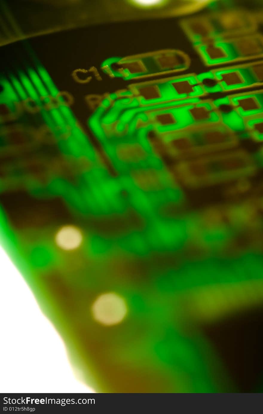 A small piece of printed circuit board over a bright lamp