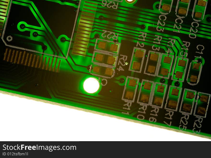 A small piece of printed circuit board over a bright lamp