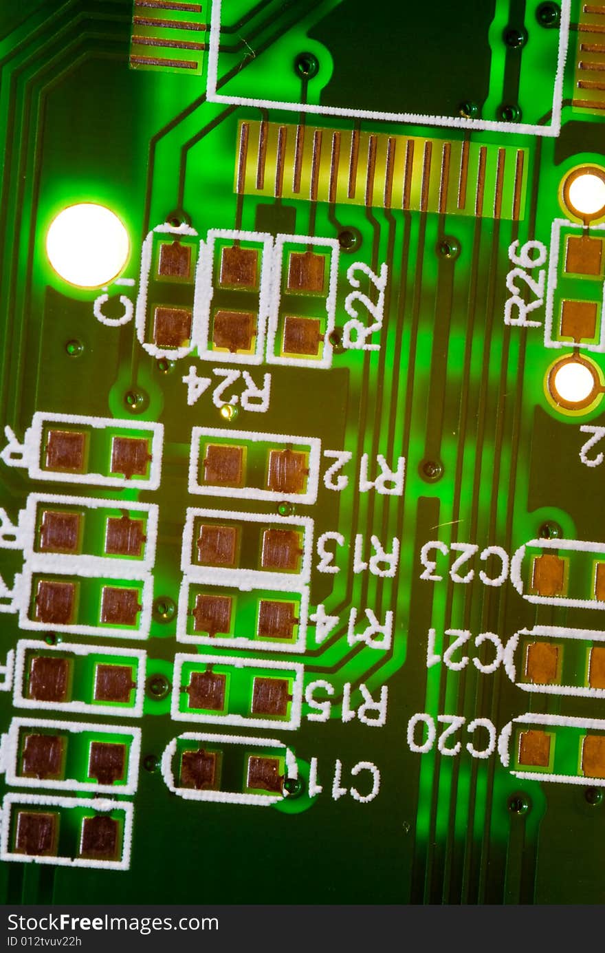 A small piece of printed circuit board over a bright lamp