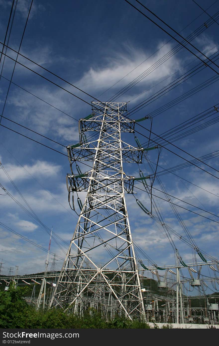 An electricity power pylon stretches into the sky. An electricity power pylon stretches into the sky