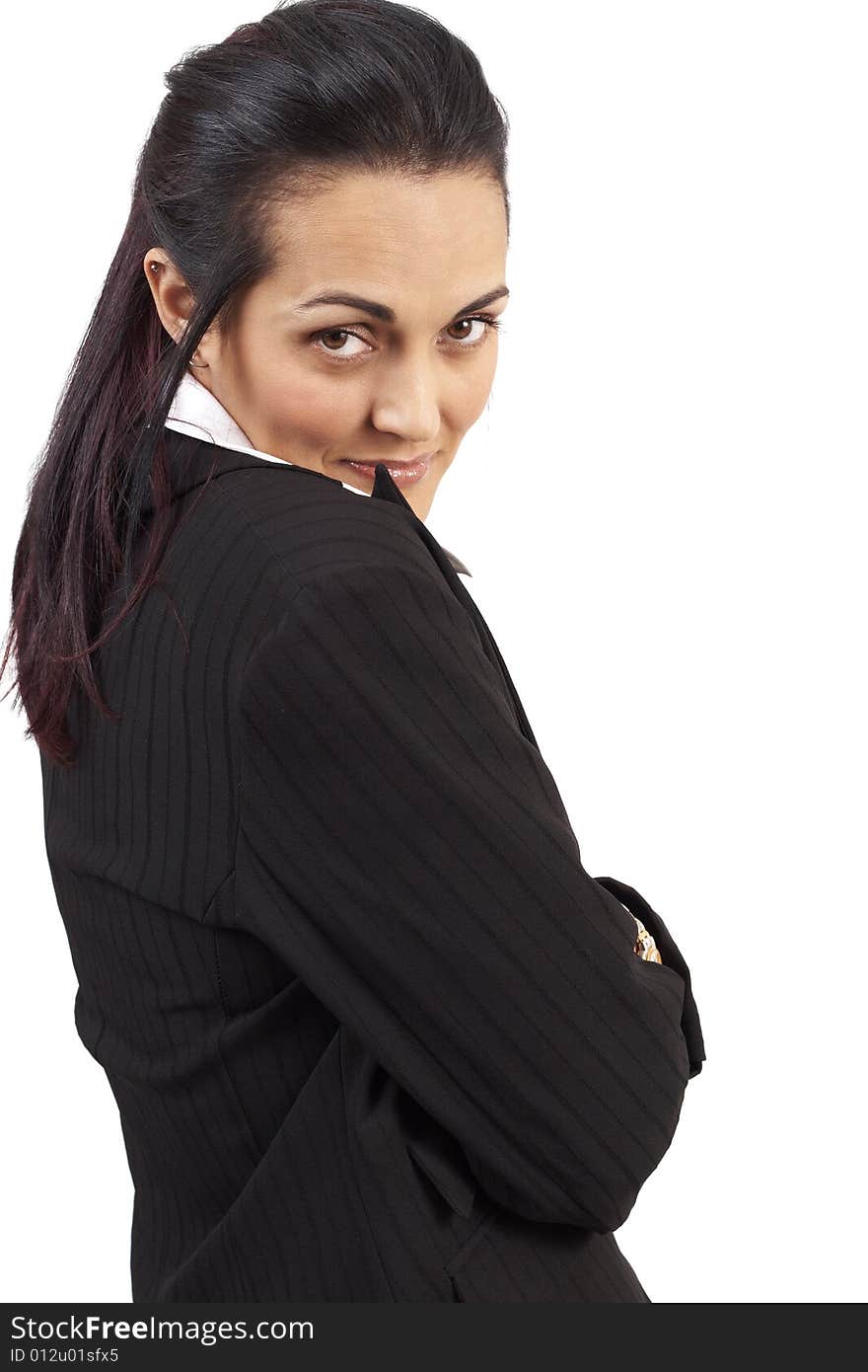 Beautiful brunette businesswoman wearing office clothes looking over her shoulder. Isolated on white background with copy space