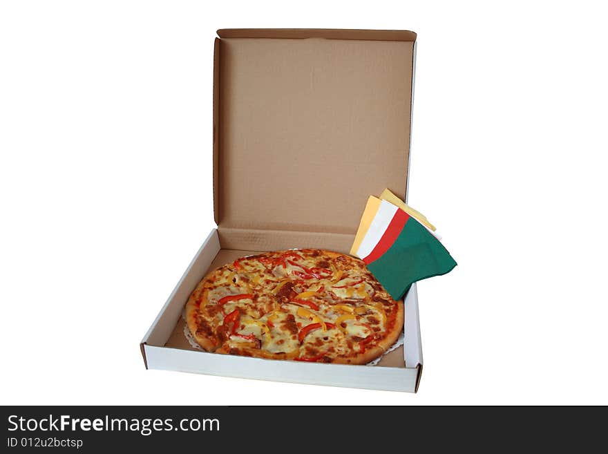 Fresh pizza lying in pasteboard box with colored tissue paper. Fresh pizza lying in pasteboard box with colored tissue paper