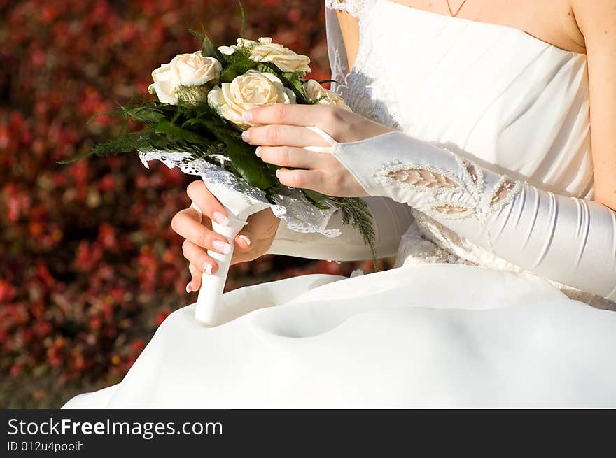 Bride with flowers on red background. Bride with flowers on red background