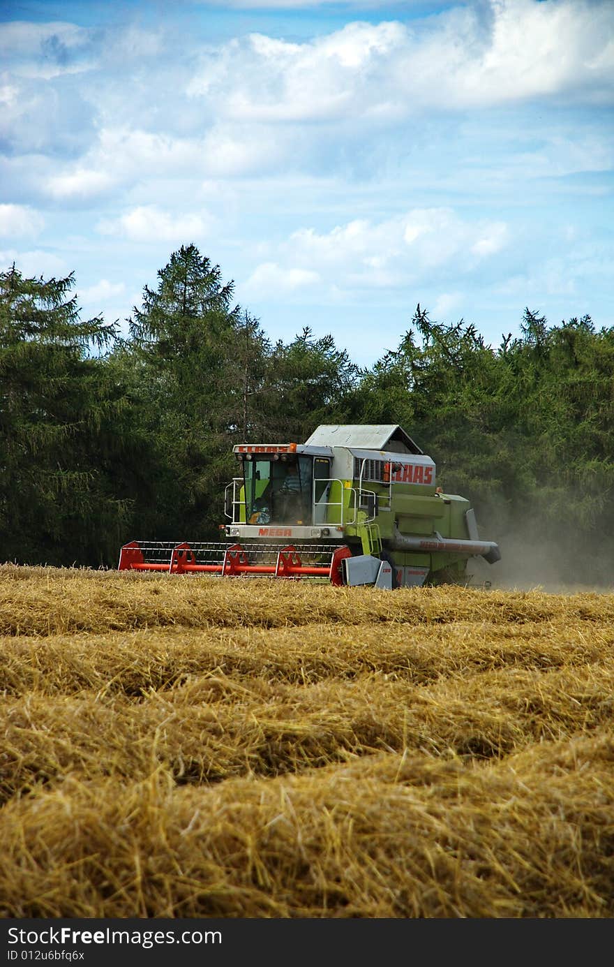 A harvester doing its job in the late summer. Czech Republic, August 2008. A harvester doing its job in the late summer. Czech Republic, August 2008.