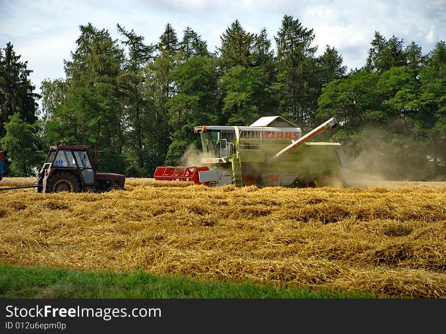 A harvester doing its job in the late summer. Czech Republic, August 2008. A harvester doing its job in the late summer. Czech Republic, August 2008.