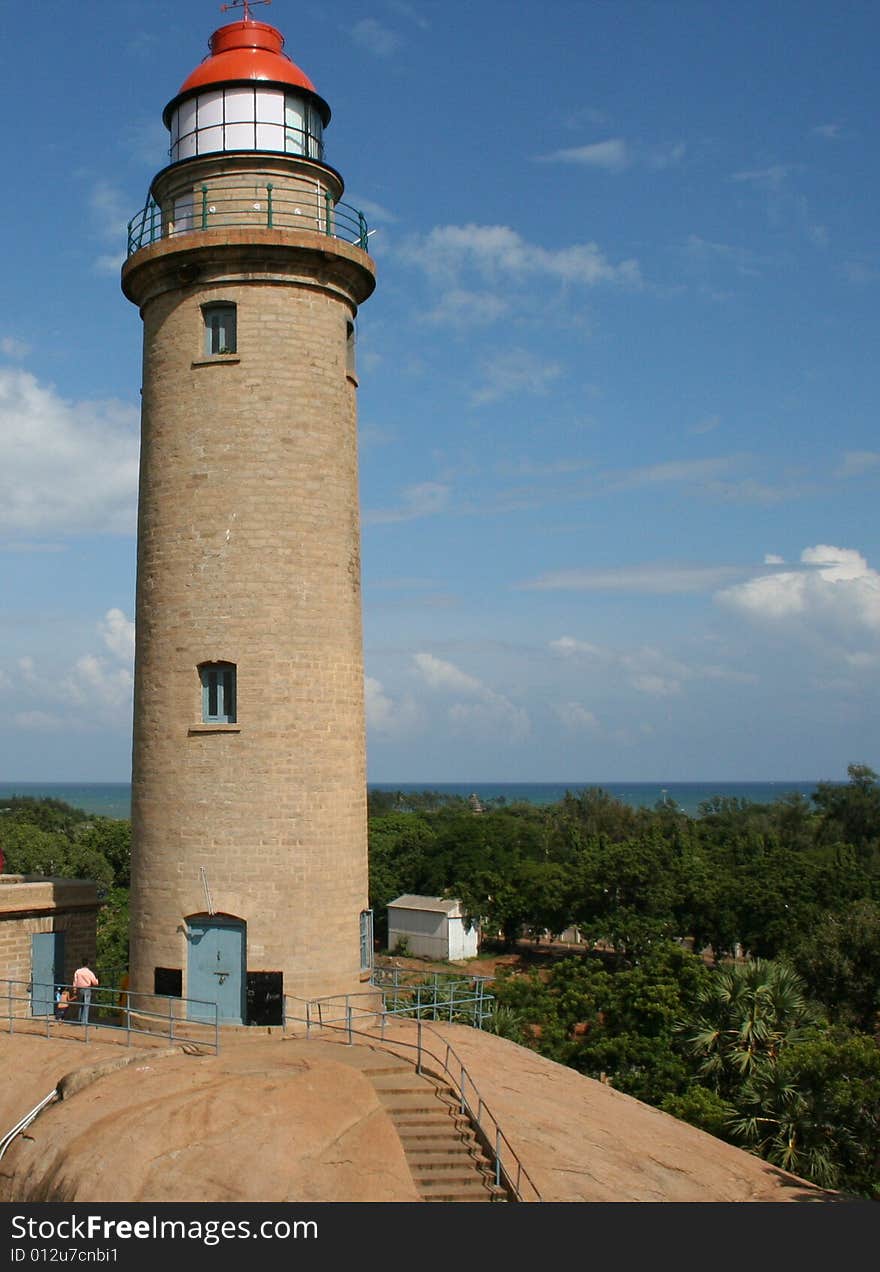 Light house with sea and sky at background