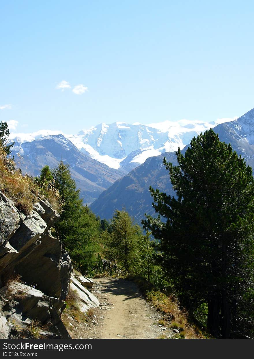 Hiking path towards a glacier in the Swiss Alpes. Hiking path towards a glacier in the Swiss Alpes