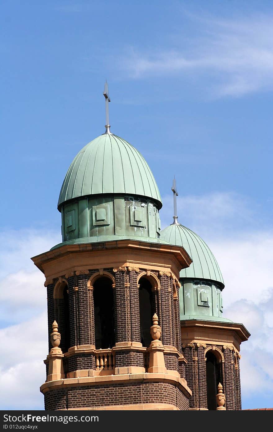 Top of a church with a blue sunny background