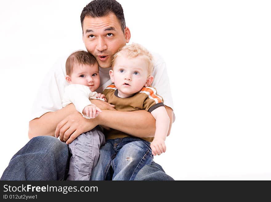 Cute brother and sister from different races having fun with daddy. Cute brother and sister from different races having fun with daddy