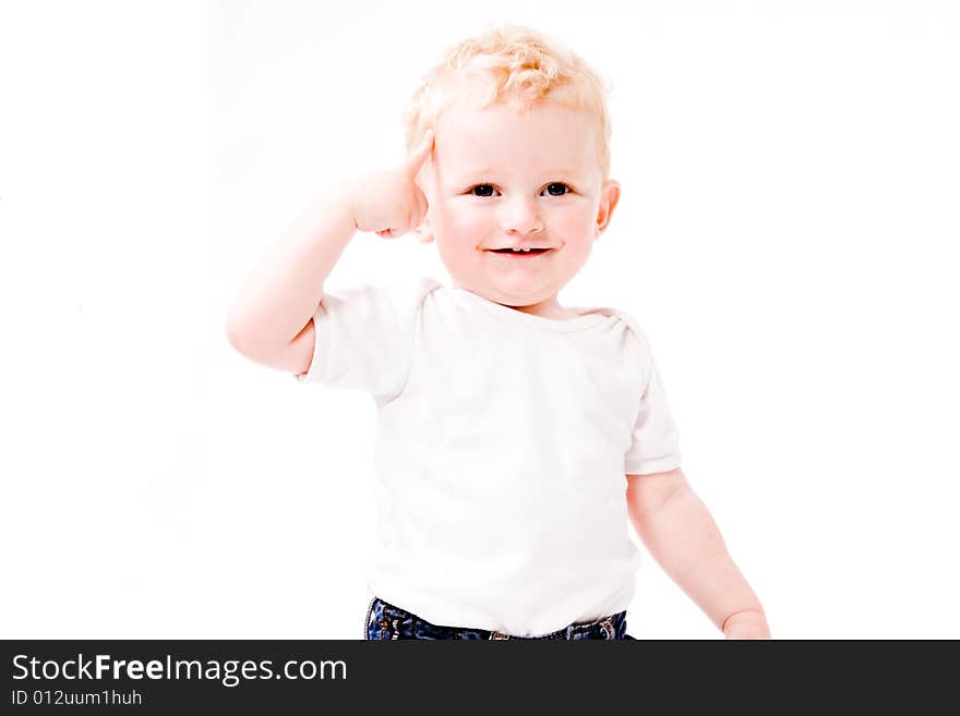 Cute Caucasian blond toddler is happy and playful. Cute Caucasian blond toddler is happy and playful