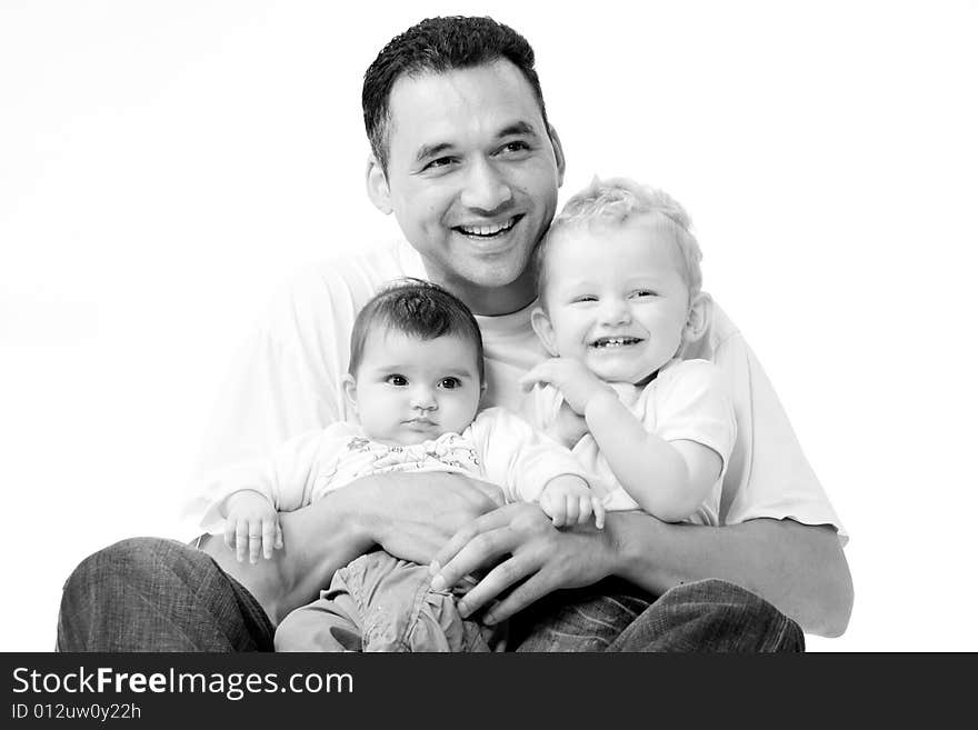 Cute brother and sister from different races having fun with daddy. Cute brother and sister from different races having fun with daddy