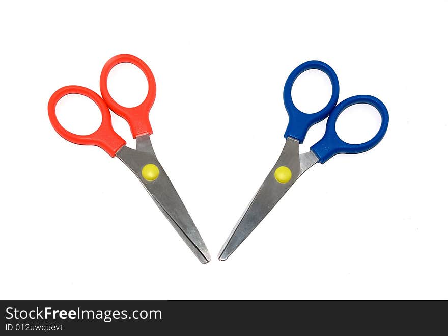 Red and dark blue scissors isolated on a white background