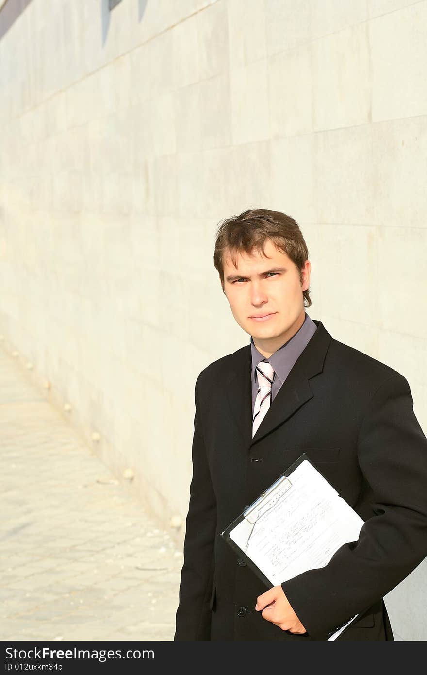 Business background: handsome businessman in a work process. Business background: handsome businessman in a work process.