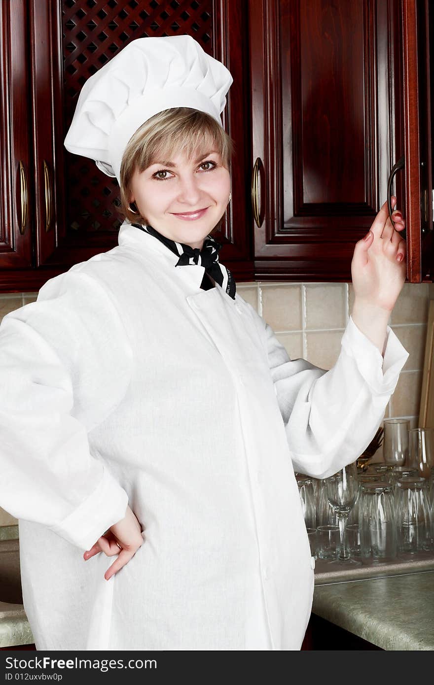 Cook woman cooking on the kitchen. Cook woman cooking on the kitchen