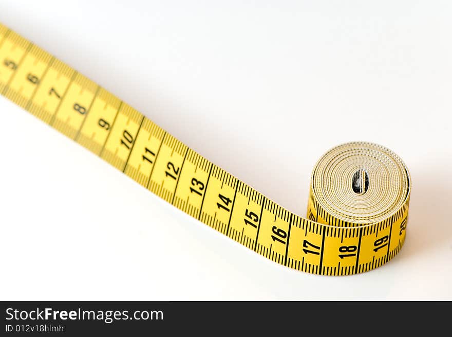 Measuring tape details over a white background