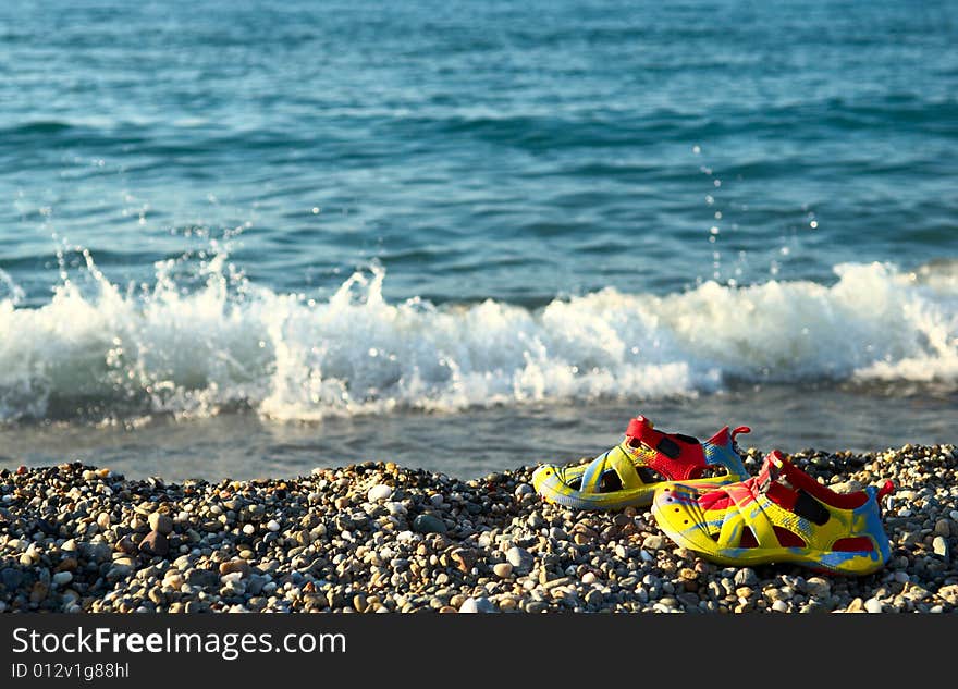 Flip flops on the pebble beach