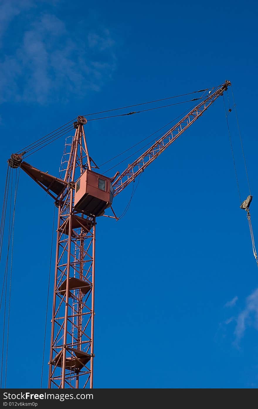 Photo of a tower crane on sky background